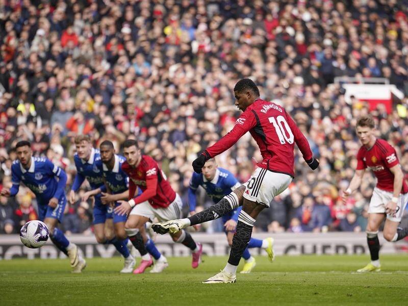 Manchester United's Marcus Rashford scores from the penalty spot in the win over Everton. (AP PHOTO)