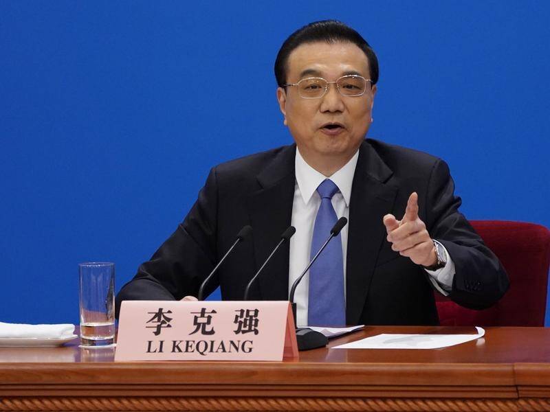 Chinese Premier Li Keqiang says Beijing does not tell companies to spy abroad for the government.