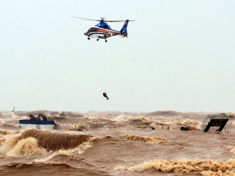 Strong winds and rain have battered the central Vietnamese coast, with 17 dead and 13 still missing.