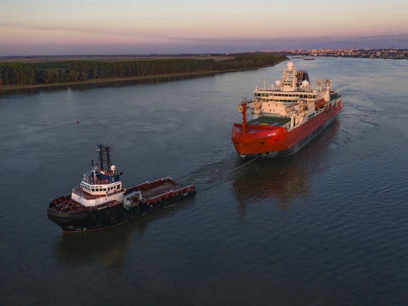 Australia's new icebreaker RSV Nuyina is being towed to a port in south Holland for commissioning.
