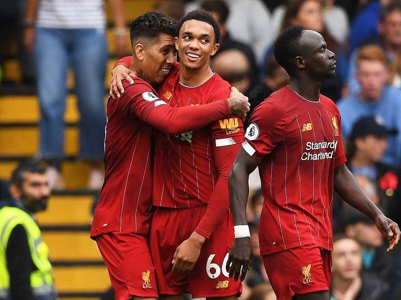 Roberto Firmino (l) and Trent Alexander-Arnold (c) scored Liverpool's goals in the win at Chelsea.