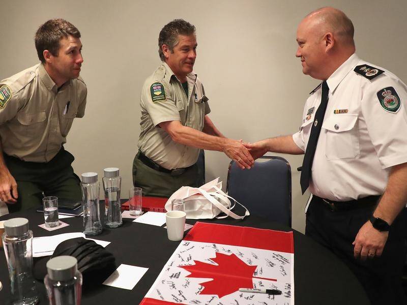 32 US and Canadian firefighters who helped battle blazes across NSW have been farewelled Friday.