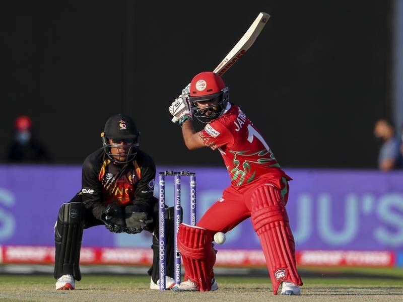 Jatinder Singh's 73 not out has helped Oman rout PNG by 10 wickets in the Twenty20 World Cup opener.