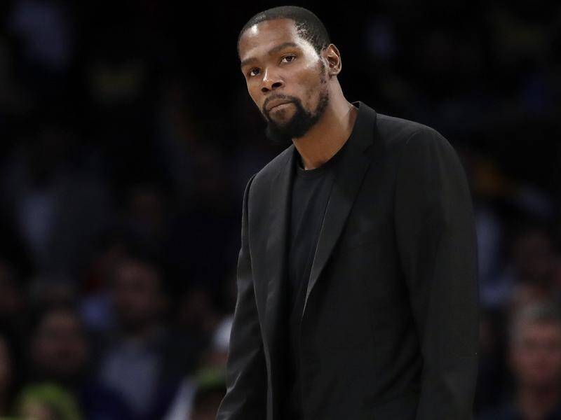 Brooklyn's Kevin Durant is one of four Nets players to test positive to the coronavirus.