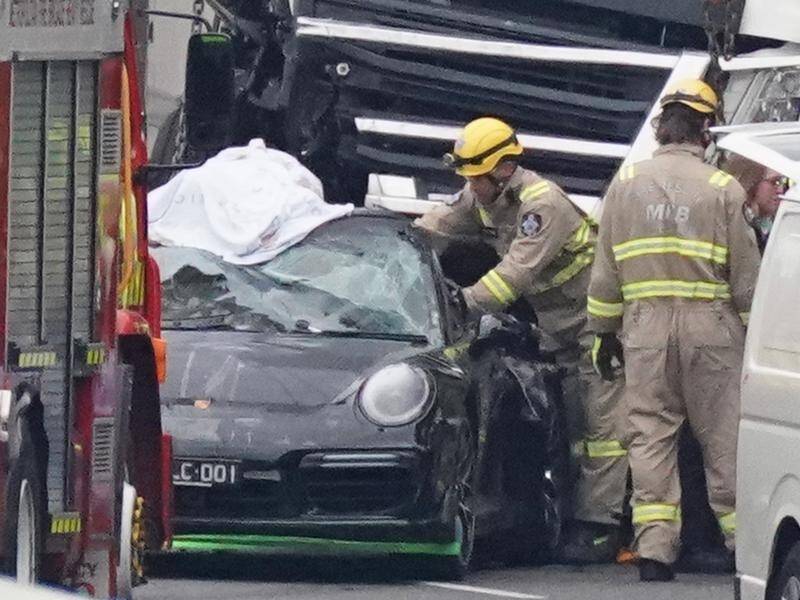 A Porsche driver allegedly fled after a truck ploughed into four police officers, killing them.
