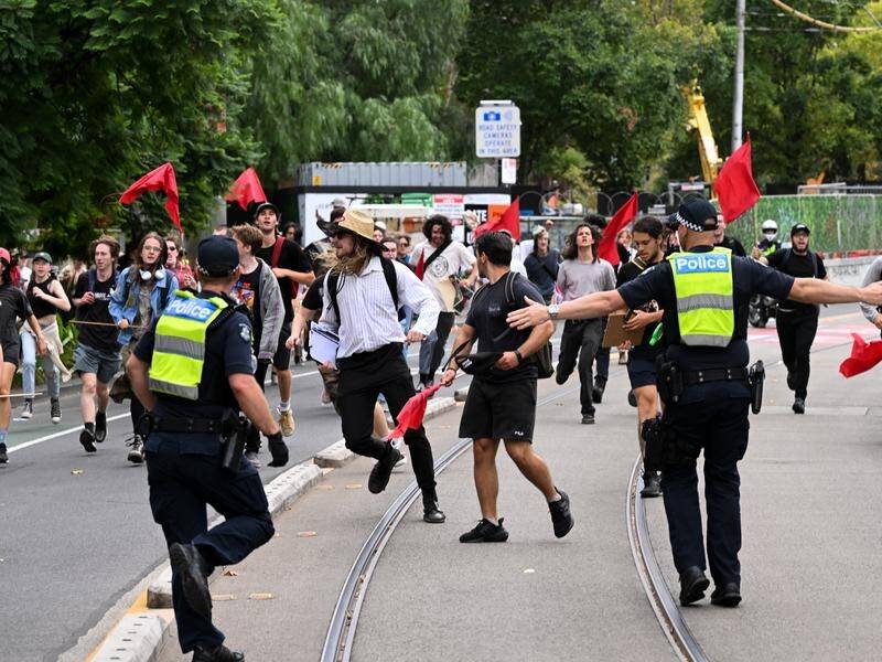 Neo-Nazis and trans rights protesters have clashed outside Parliament House in Melbourne. (James Ross/AAP PHOTOS)