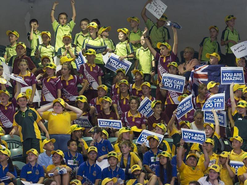 School children cheer during the swimming event at the Invictus Games in Sydney,