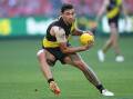 Richmond's Tim Taranto is expected to miss up to eight weeks with a broken wrist. (Julian Smith/AAP PHOTOS)