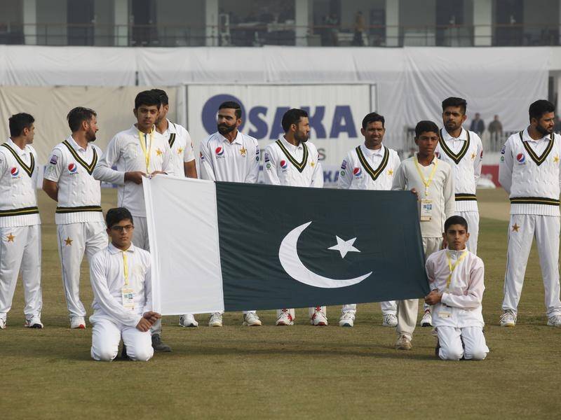 Pakistani players gather before the first Test played in their country in a decade.