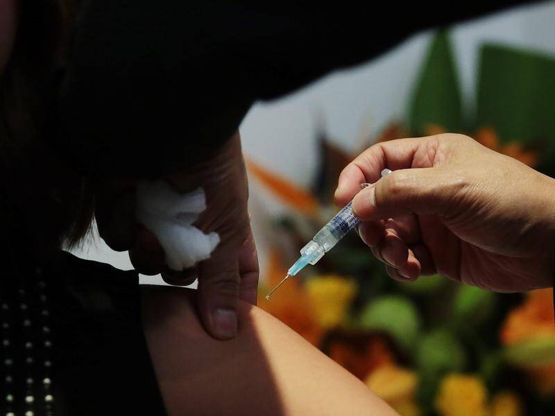 A Queensland man, whose 35-year-old "fit" wife died from flu, is urging people to get the flu shot.