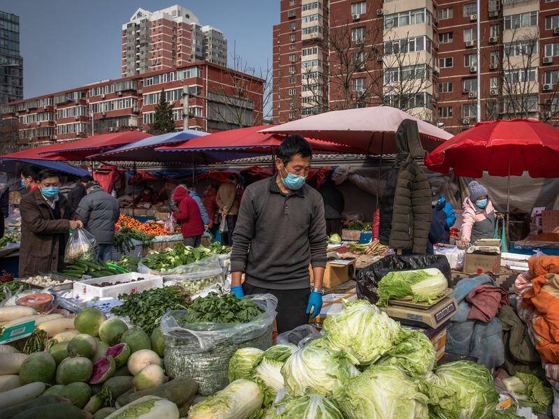 Extreme weather and COVID-19 outbreaks threaten to disrupt China's food supplies.