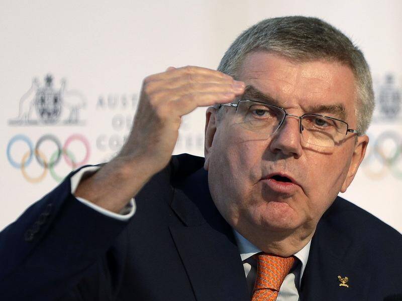 IOC president Thomas Bach says the body will take a significant financial hit over the Tokyo Games.