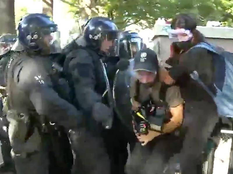 Seven reporter Amelia Brace and her camera operator were beaten by police in the US capital.