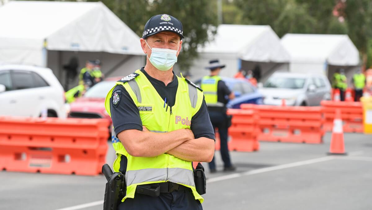 Victoria Police Acting Senior Sergeant Steve Corrigan mans the border checkpoint on the Lincoln Causeway. Picture: Mark Jesser