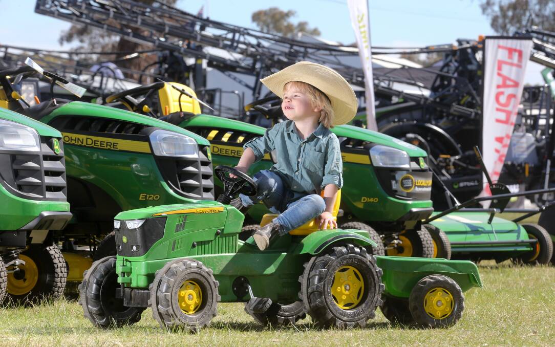 FUTURE FARMER: Three-year-old Augustus Henderson, from Bemboka, tries out a tractor at the Henty Machinery Field Days. Picture: KYLIE ESLER