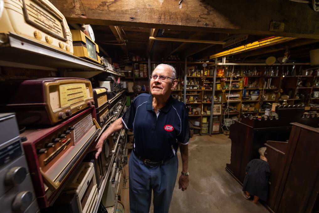 COLLECTOR: Les Dale in the basement of the Henty IGA which features a museum of the town. The store celebrates its 60th anniversary on Monday, while Mr Dale has been a business owner for 67 years. Picture: MARK JESSER