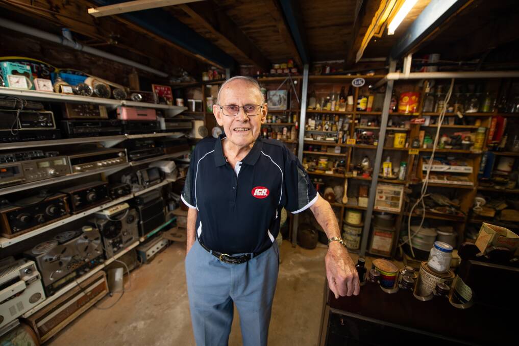 COLLECTOR: Les Dale in the basement of the Henty IGA which featuring a museum of the town. The store celebrates its 60th anniversary on Monday, while Mr Dale has been a business owner for 67 years. Picture: MARK JESSER