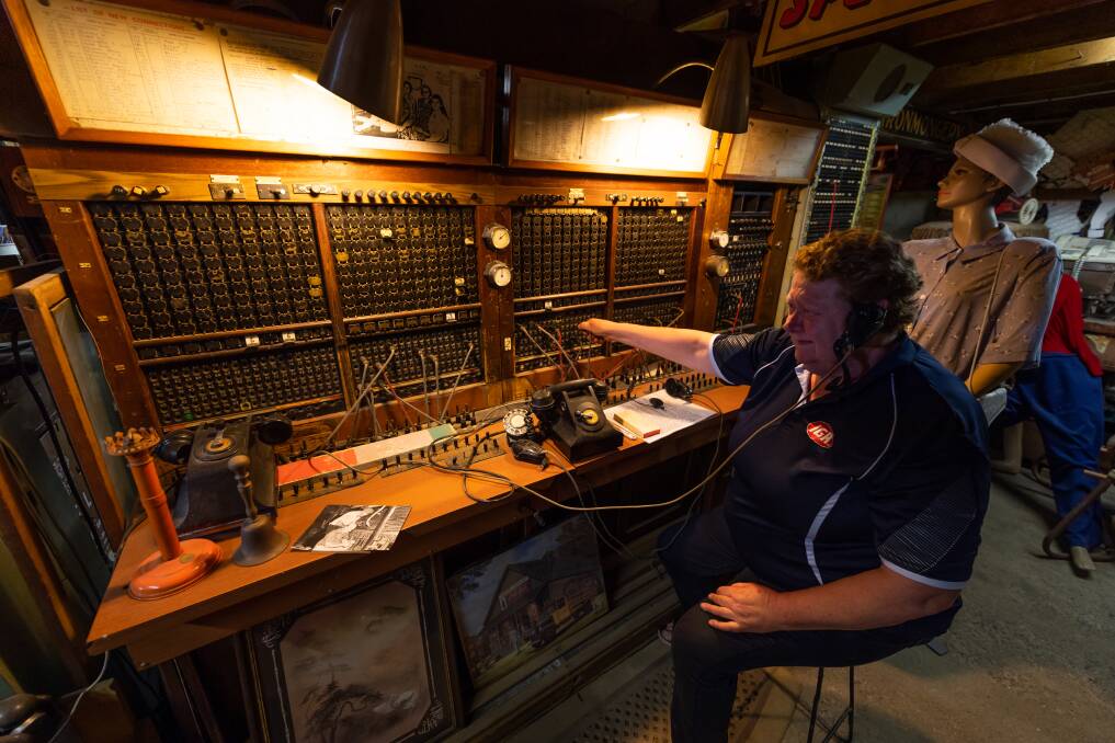 HISTORY: Dale's IGA and Liquor manager Narelle Morey demonstrating the town's old manual phone switchboard. Picture: MARK JESSER