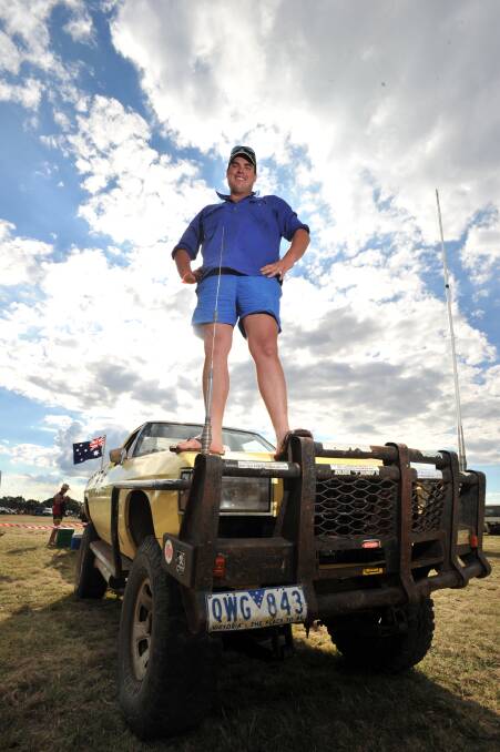 Kenny O'Connell stands on top of his copy of the Holden Overlander at the Elmore Summer Send Off Ball
120311
Pb Jim Aldersey
