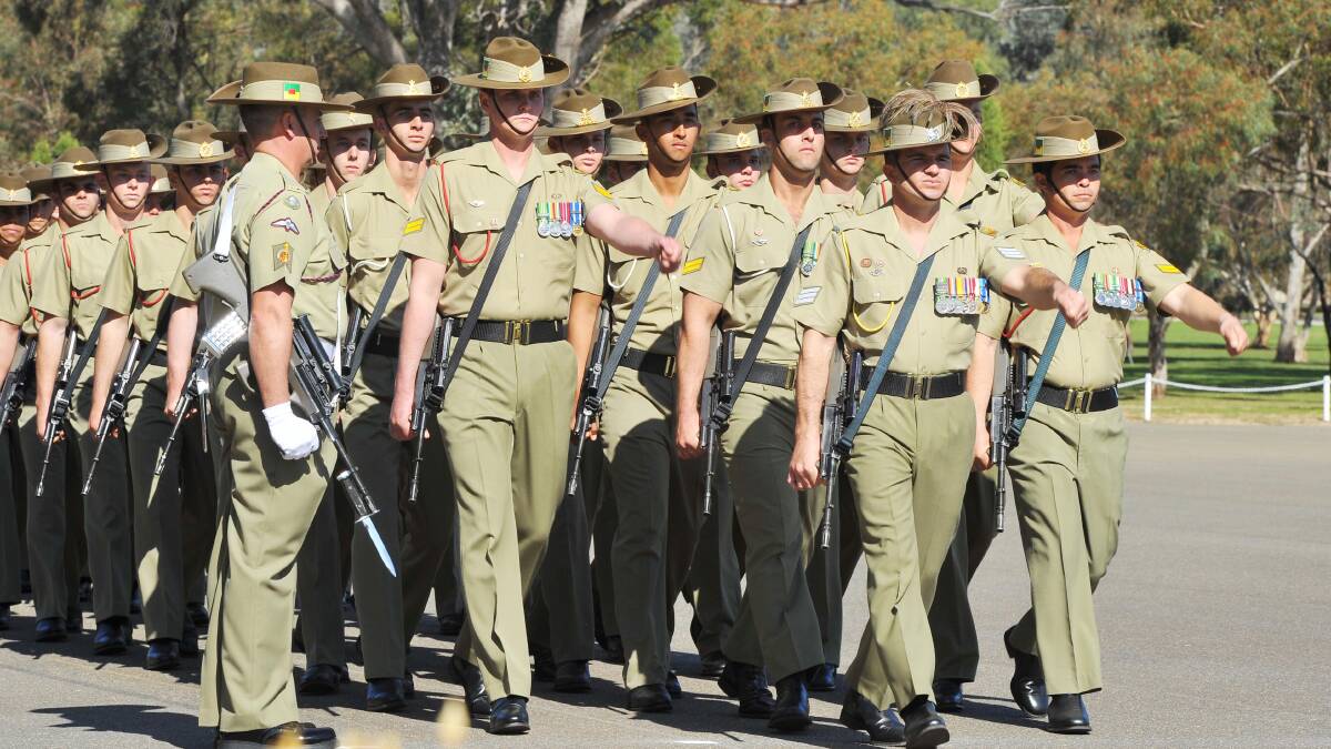 Anzac Day march out at Kapooka. Platoon 36, led by Platoon Sergeant Raymond Grzyb, marches past Parade Sergeant Major WO 2 Steve Neal. Picture: Kieren L Tilly