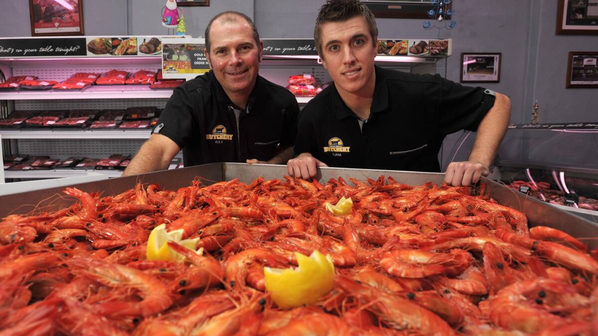 PRAWN STARS: South Wagga Butchery manager Ray Farrell and owner Liam Hanigan expect to sell more than one-and-a-half tonne of prawns this Christmas. Picture: Les Smith