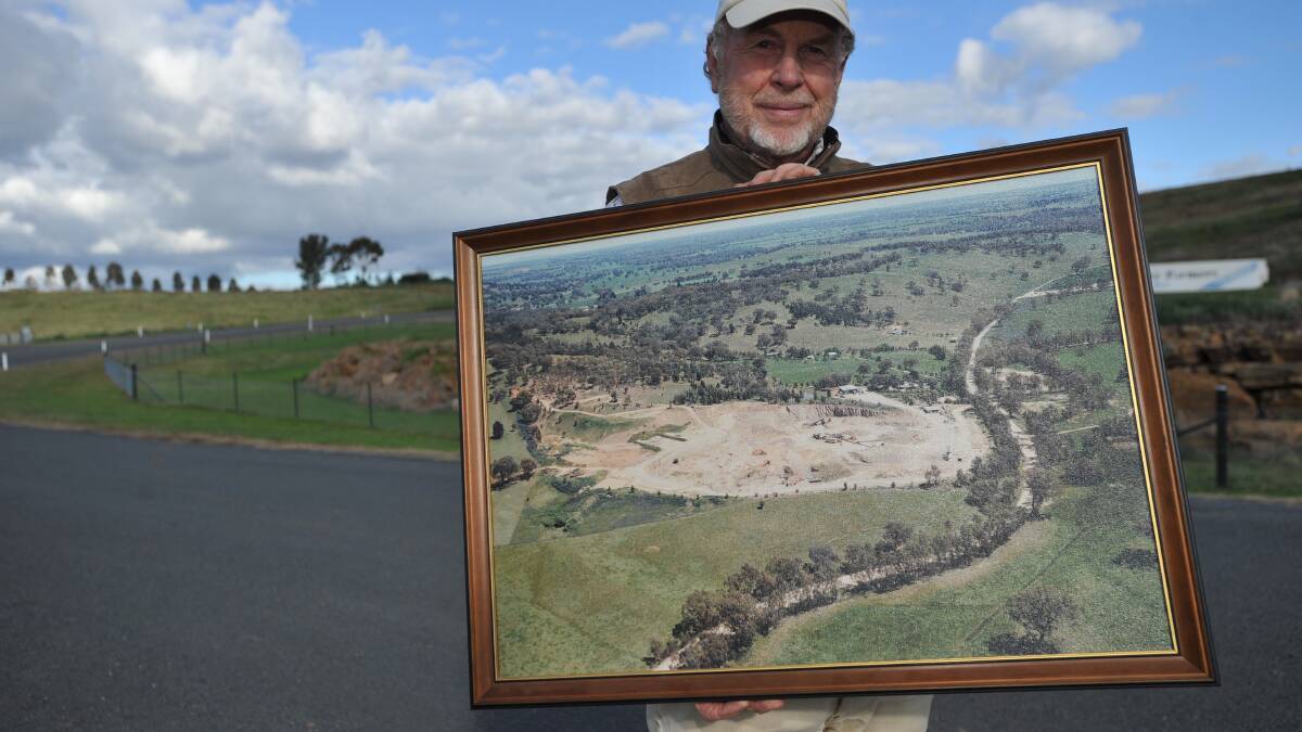 FA Delaney Quarries owner Peter Delaney holds a picture of his quarry from the mid-1990s. Picture: Laura Hardwick