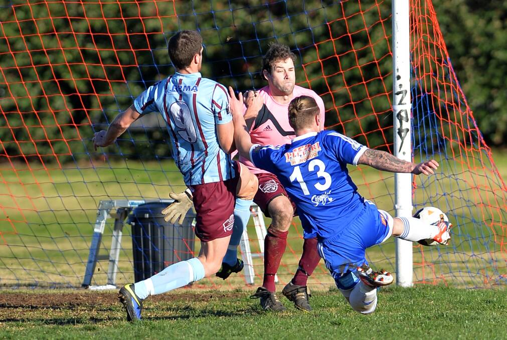 TOO GOOD: Hanwood player Matthew Fearon gets one past Eastern Wanderers keeper Aaron Thomas and defender Sam Mangelsdorf during the game at Gissing Oval. Pictures: Michael Frogley