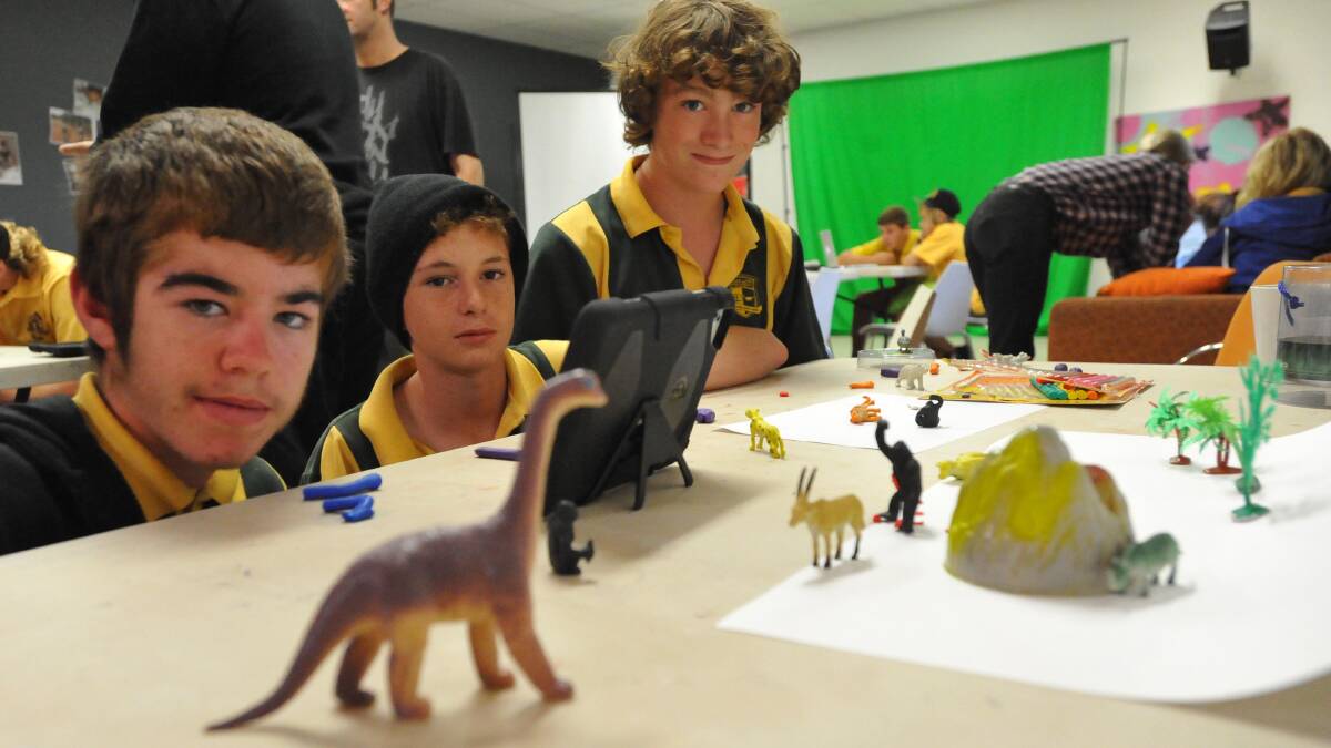Mount Austin boys Tyson Javdzemis, Zac Meriton and Nathan Rose at work creating a film using movement in pictures at a Youth Week workshop. Picture: Laura Hardwick