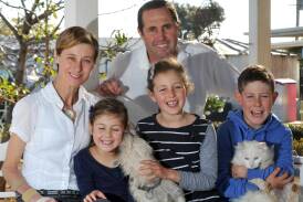 Kim and Geoff Hunt with their children Phoebe, Mia and Fletcher in 2013. Picture: Les Smith