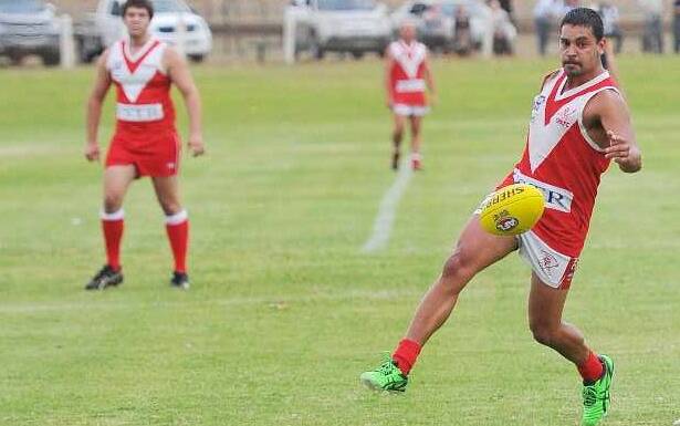 Chris Gordon kicks one away for CAK in the Charity Shield game between Collingullie-Ashmont-Kapooka and Billabong Crows at Narrandera. Picture: Kieren L Tilly