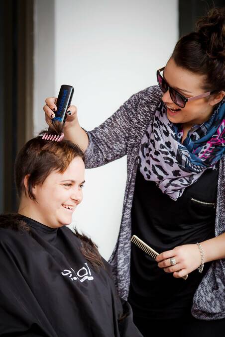 Samantha Polsen has her head shaved for The Worlds Greatest Shave in Gundagai on Sunday. Samantha has raised over $2,000. Picture: Alice Taprell