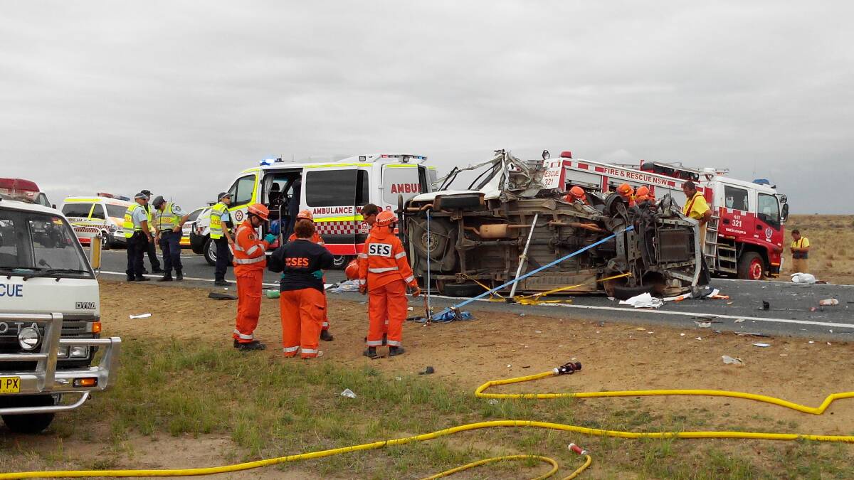 The scene of Friday's crash involving a Toyota Hiace and a B-double on the Sturt Highway west of Hay. 