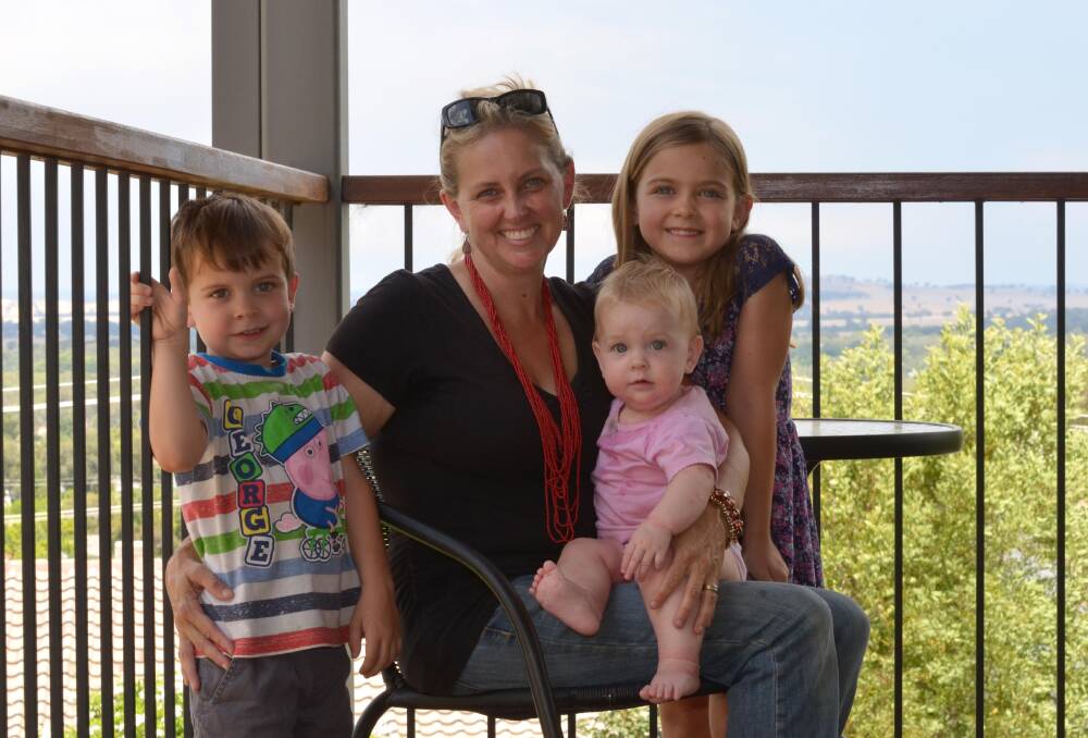 Jenny Wallace (centre) and her three children Digby, 4, Imogen, 9 months and Alexandra, 7 call Wagga home. Mrs Wallace said Wagga had plenty to offer and needed to talk about it more. Picture: Declan Rurenga