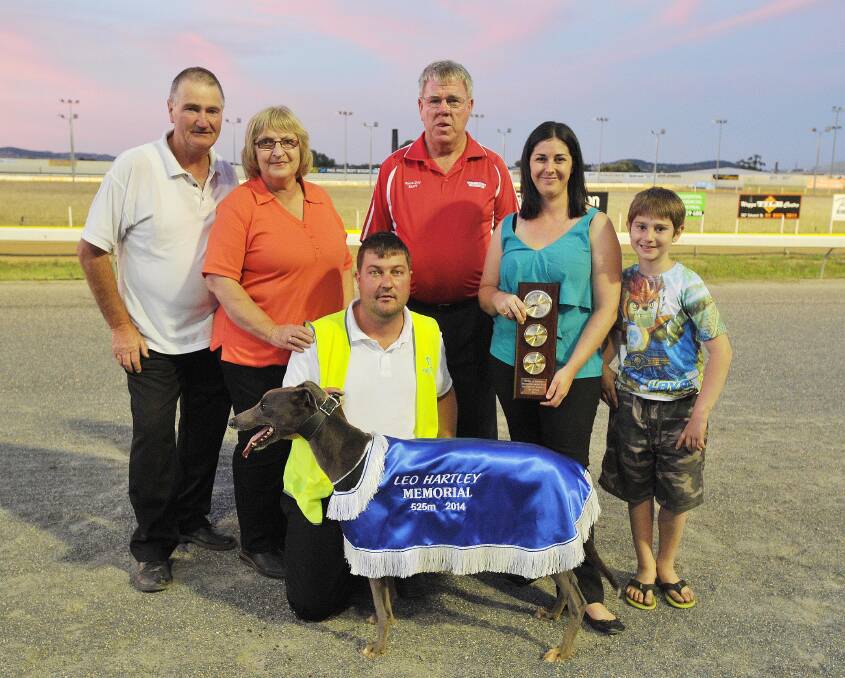 WINNERS ARE GRINNERS: Celebrating trainer Craig Davis (front) and Blue Mayhem's win in the Leo Hartley Memorial Final are (from left) proud parents Malcolm and Chris Davis, Wagga Greyhound Club secretary and son of Leo Hartley, John Hartley, wife Sonia and son Connor, 8. Picture: Kieren L Tilly.