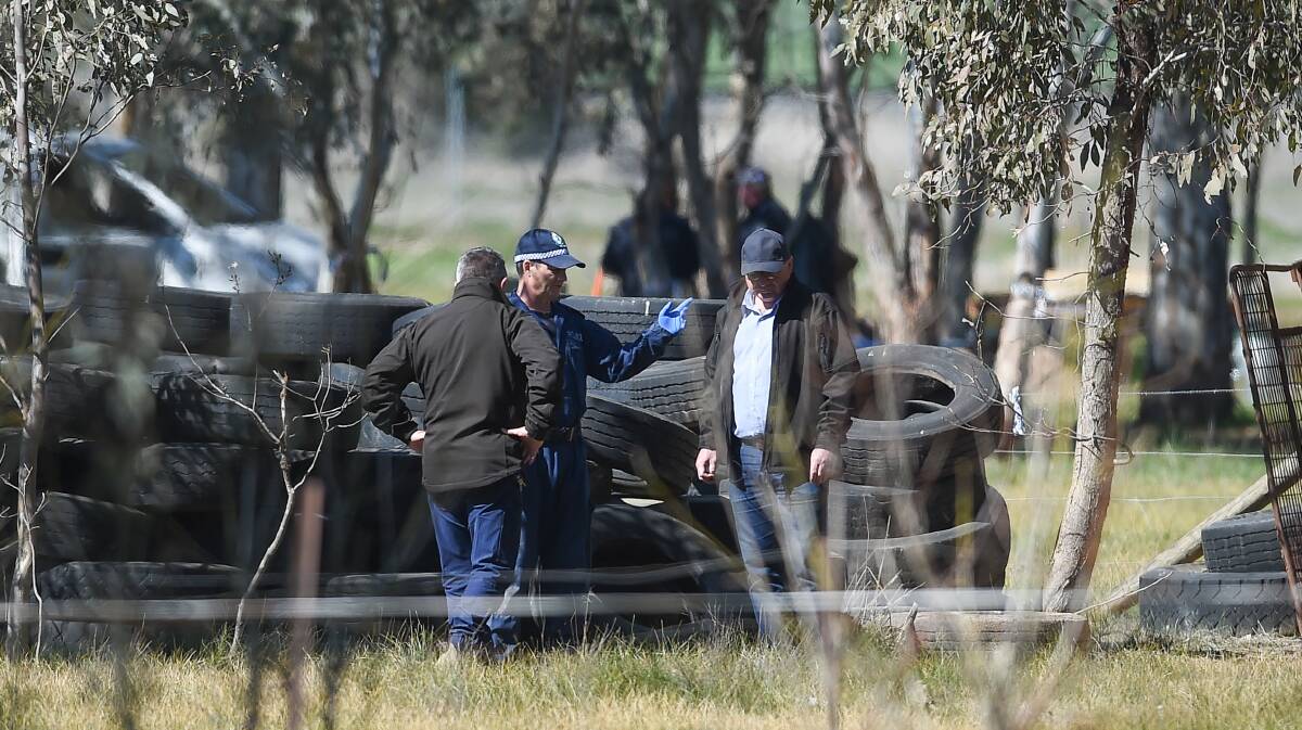SEARCH: Police searching a pile of tyres used to break in horses at a Gerogery property in August 2019. William Chaplin's body was found nearby with remnants of a bonfire following his murder nine years earlier. 