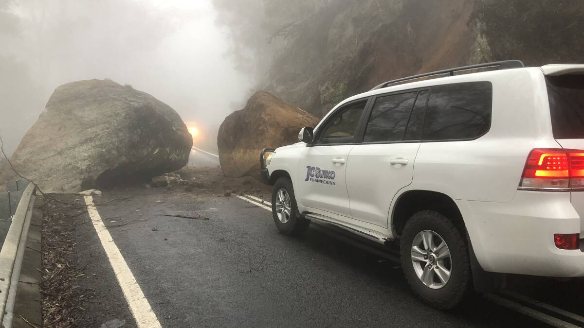 BLOCKED: The boulders covered the road. 