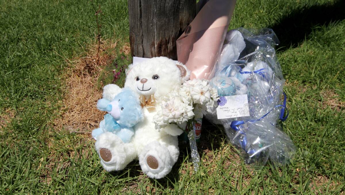 Tributes left to the late baby boy outside his home. 