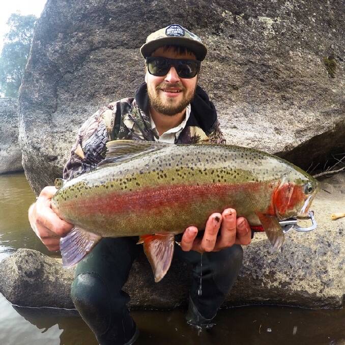 CATCH: Jeremy Kanck with a trout caught in an Alpine stream.