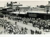 PARADE: A 1951 parade in Baylis Street re-enacting the voyage of Charles Sturt down the Murrumbidgee and Murray Rivers was watched by thousands of Wagga citizens. Photo: Gissing Collection.