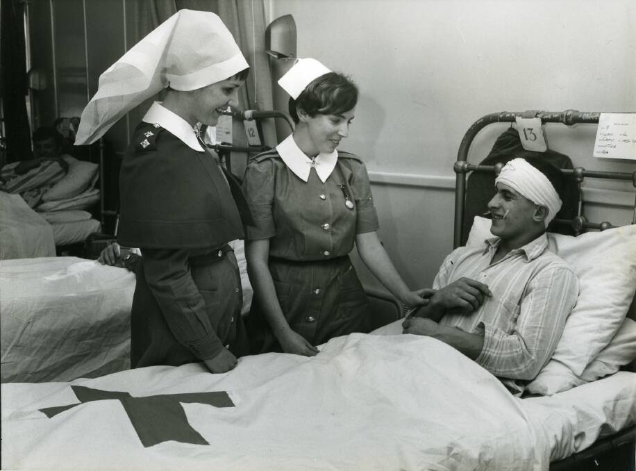 CARING: A Kapooka hospital patient here with two nurses from the hospital, June 1968. Picture: Lennon Collection at CSURA RW1574.551