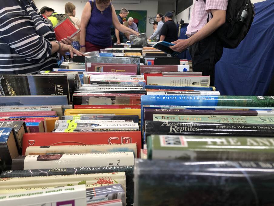Members of the Friends of the Library (FOTL) help run the library's bi-annual Book Sale.