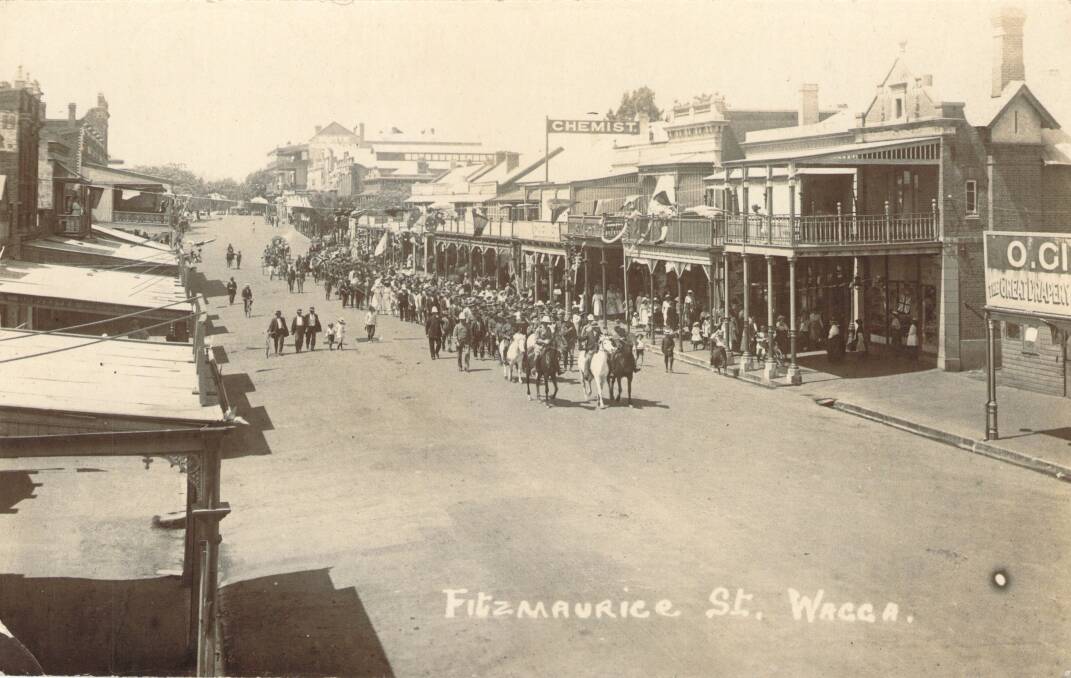 PARADING: An early street parade in Fitzmaurice Street. The Australian Hotel is visible on the hill in the background.