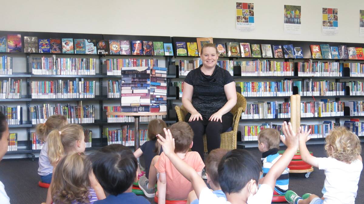 FUN: Storytime presenter Jeannie Hazell entertains the kids at Storytime.