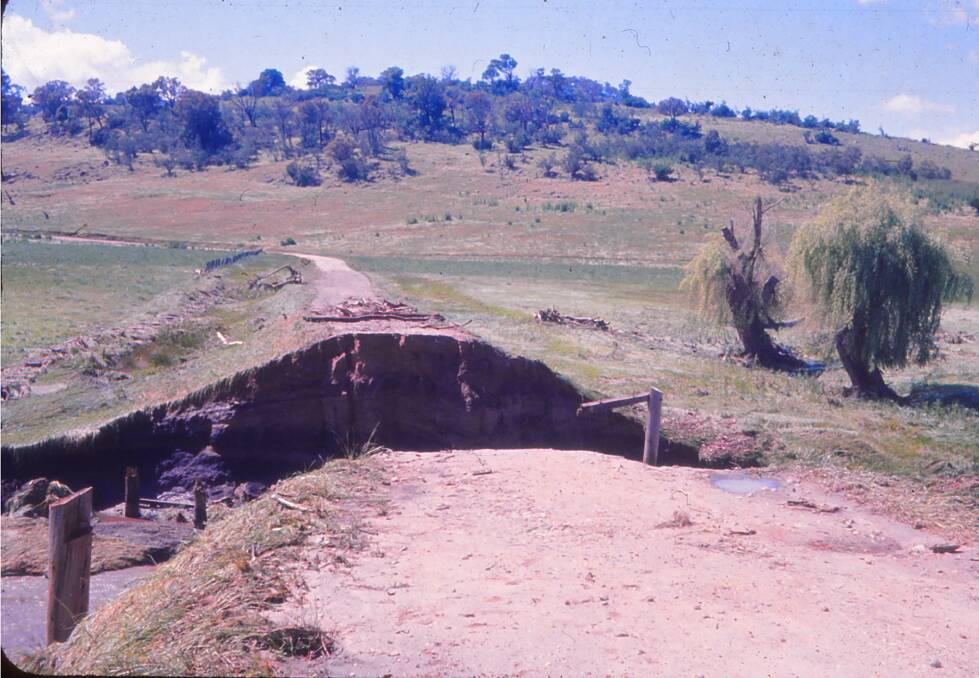 DESTROYED: Gone after 170mm in six hours. The wooden bridge was completely washed away in 1969.