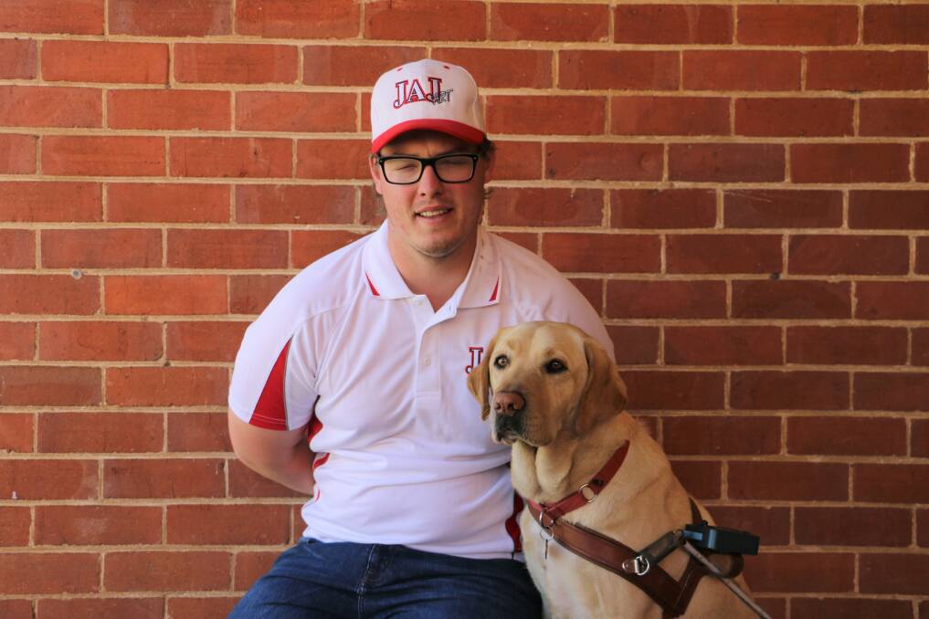 ON THE JOB: Joel Jensen wants to remind people not to pat his guide dog Nicci when her harness is on. Picture: Jessica McLaughlin