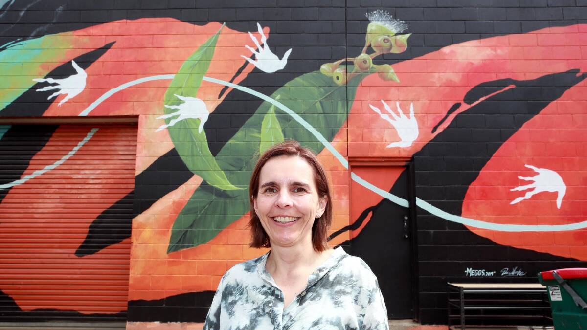 CREATIVE FLAIR: Fiona Hamilton is keen to see another mural grace Wagga's streets, adding to existing pieces like that pictured on Cadell Place. Picture: Les Smith
