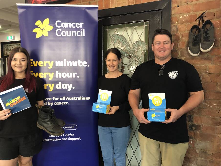 LACE UP: The Palm and Pawn staff Maddy Flood, Amy Fealy and Ossie Sutton are already walking towards making a difference, with three weeks of the challenge left. Picture: Supplied by Cancer Council