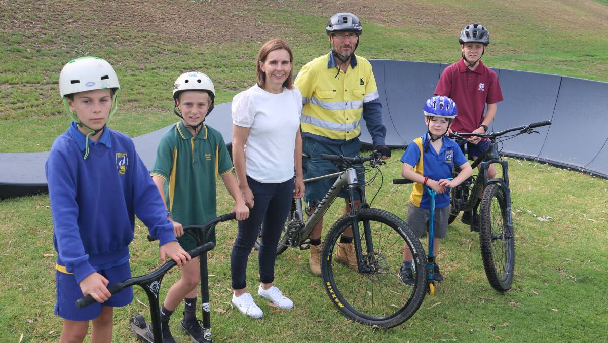 ROLLING IN: Wagga's Hayden Kennedy, 11, Toby Owers, 9, Fiona Hamilton, Rob Owers, Grayson Kennedy, 8, and Zac Owers, 13, test out the brand new track. Picture: Jessica McLaughlin