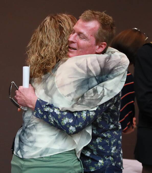 Tim Weeks embraces his sister in law Anthea Weeks. Picture: Les Smith