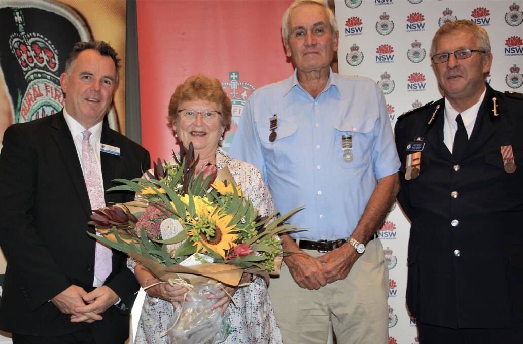 DEDICATED SERVICE: Kerry Campbell celebrates receiving his National Medal, joined by Dallas Tout, wife Kathy Campbell and NSW RFS Superintendent Paul Jones. Picture: Contributed
